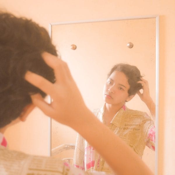 Person looking in mirror