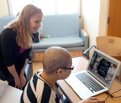 A young cancer patient enjoys playing Nanobots Revenge