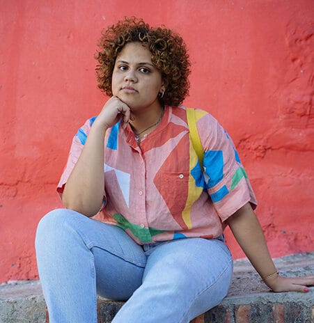 A person sitting on a curb