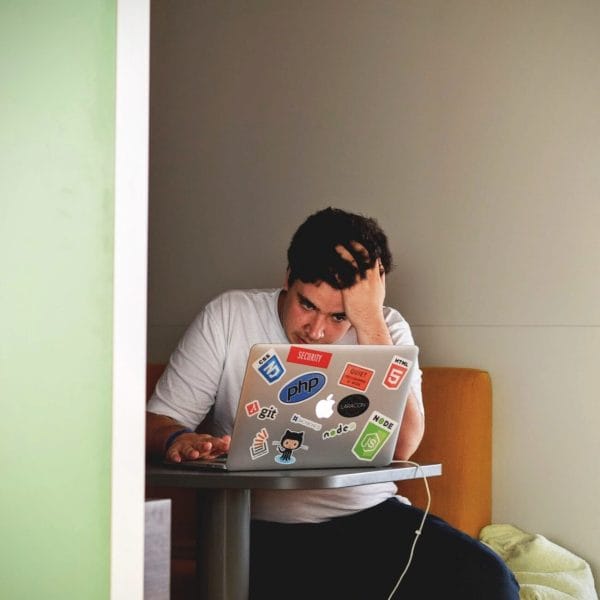 Stressed teen looking at laptop