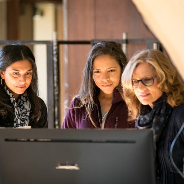 hopelab team looks at a computer screen